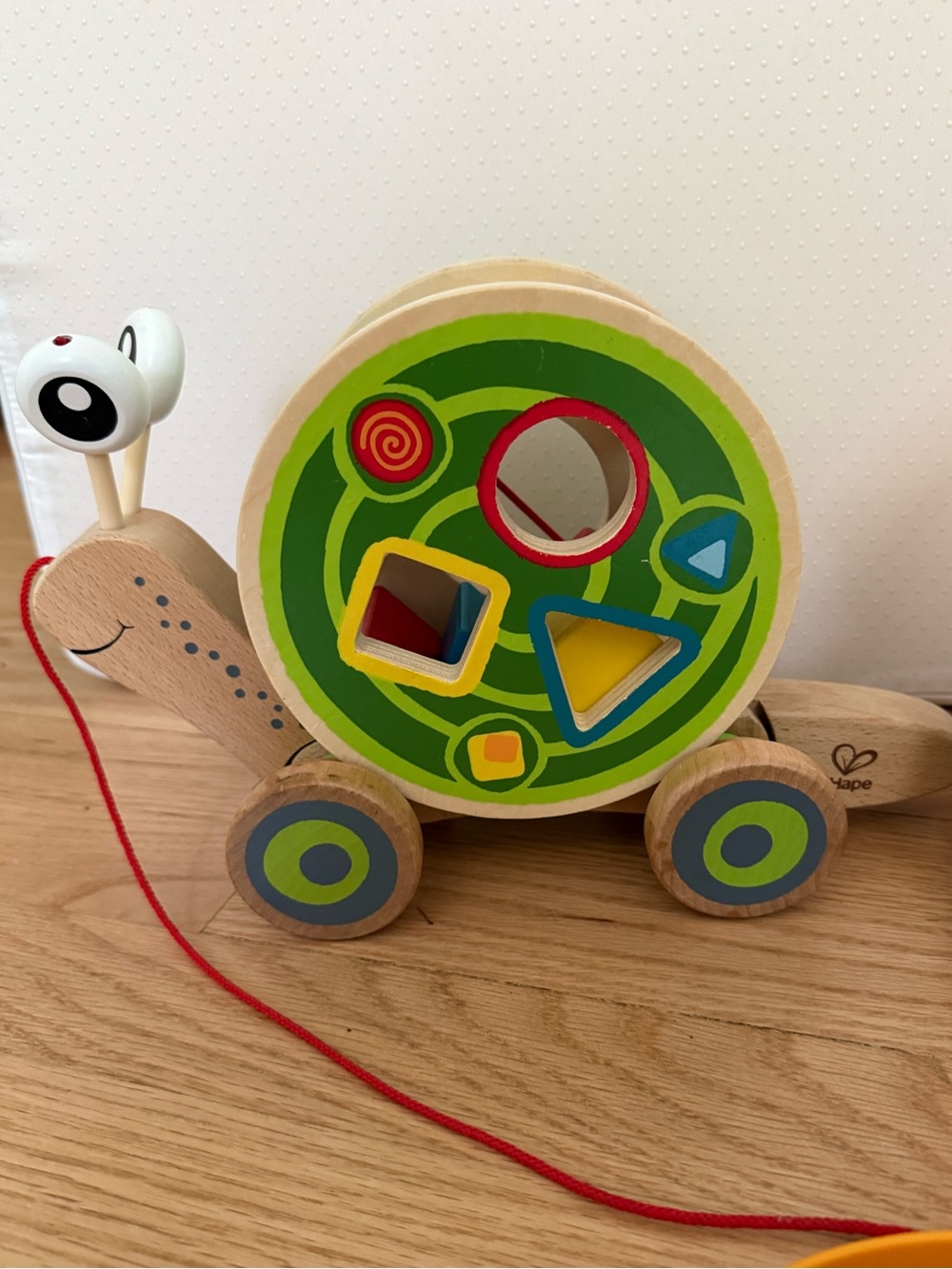 Hape Walk Along Snail Green and Shape Sorter Pull Toy